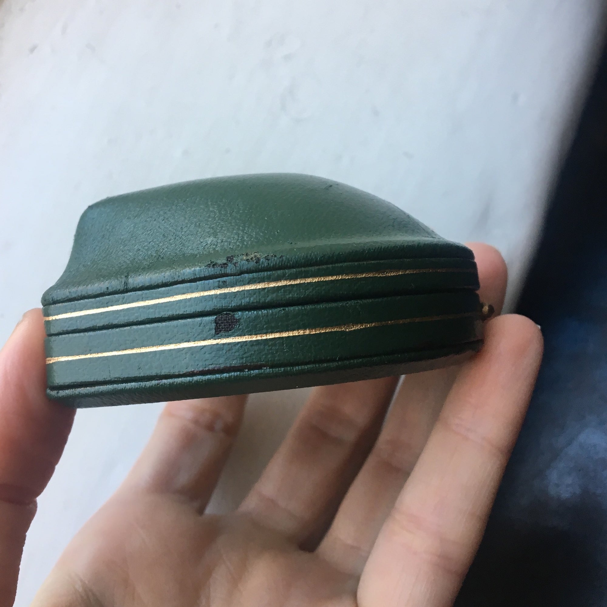 Domed leather boxes with gold trim detail