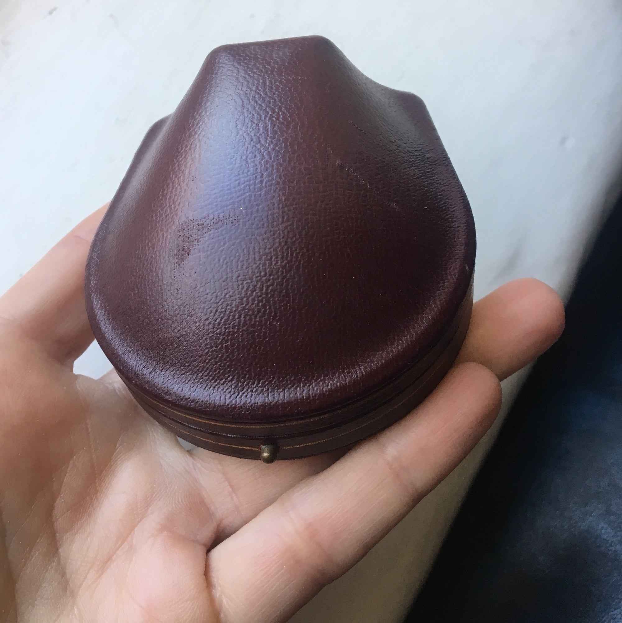 Domed leather boxes with gold trim detail