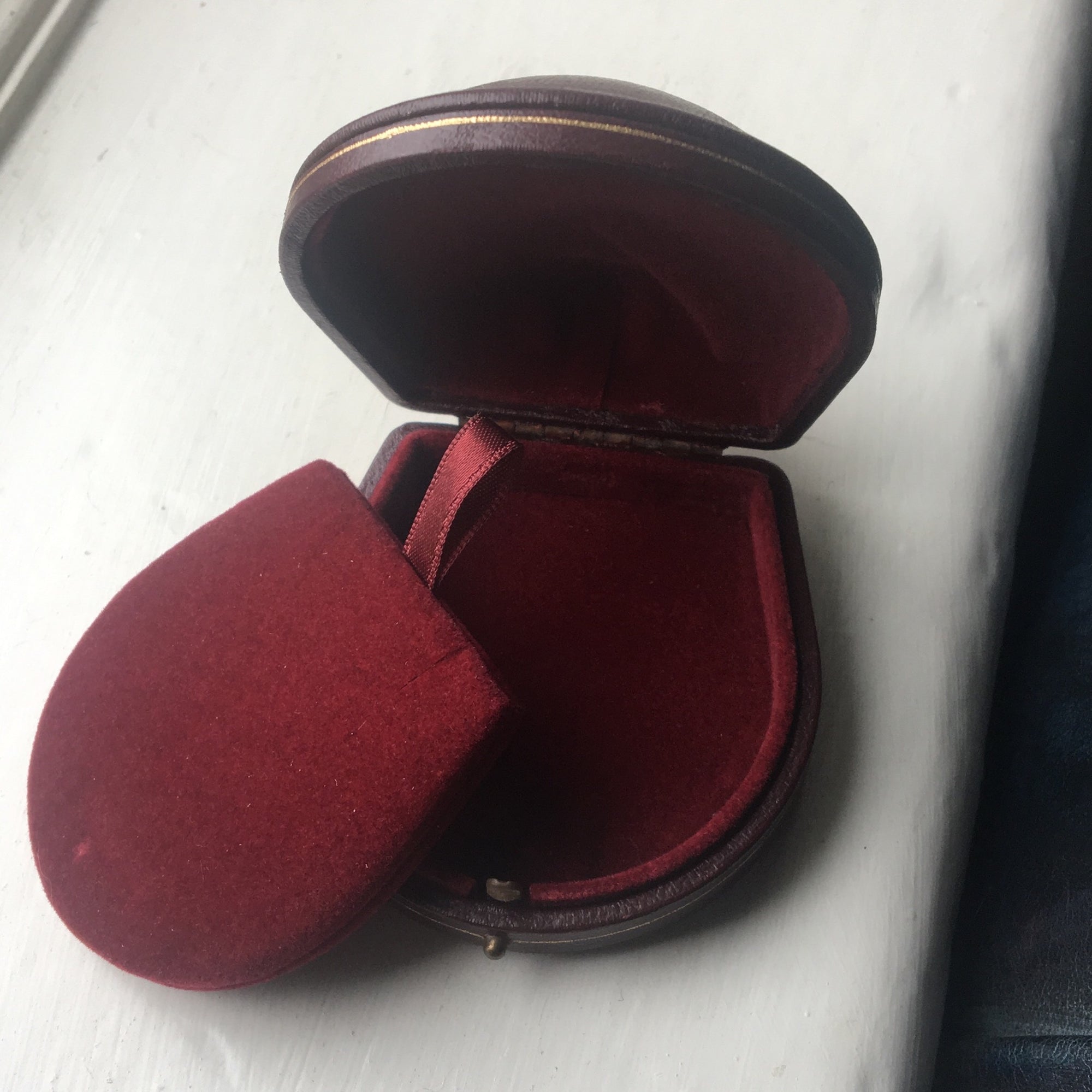 Domed leather boxes with gold trim detail