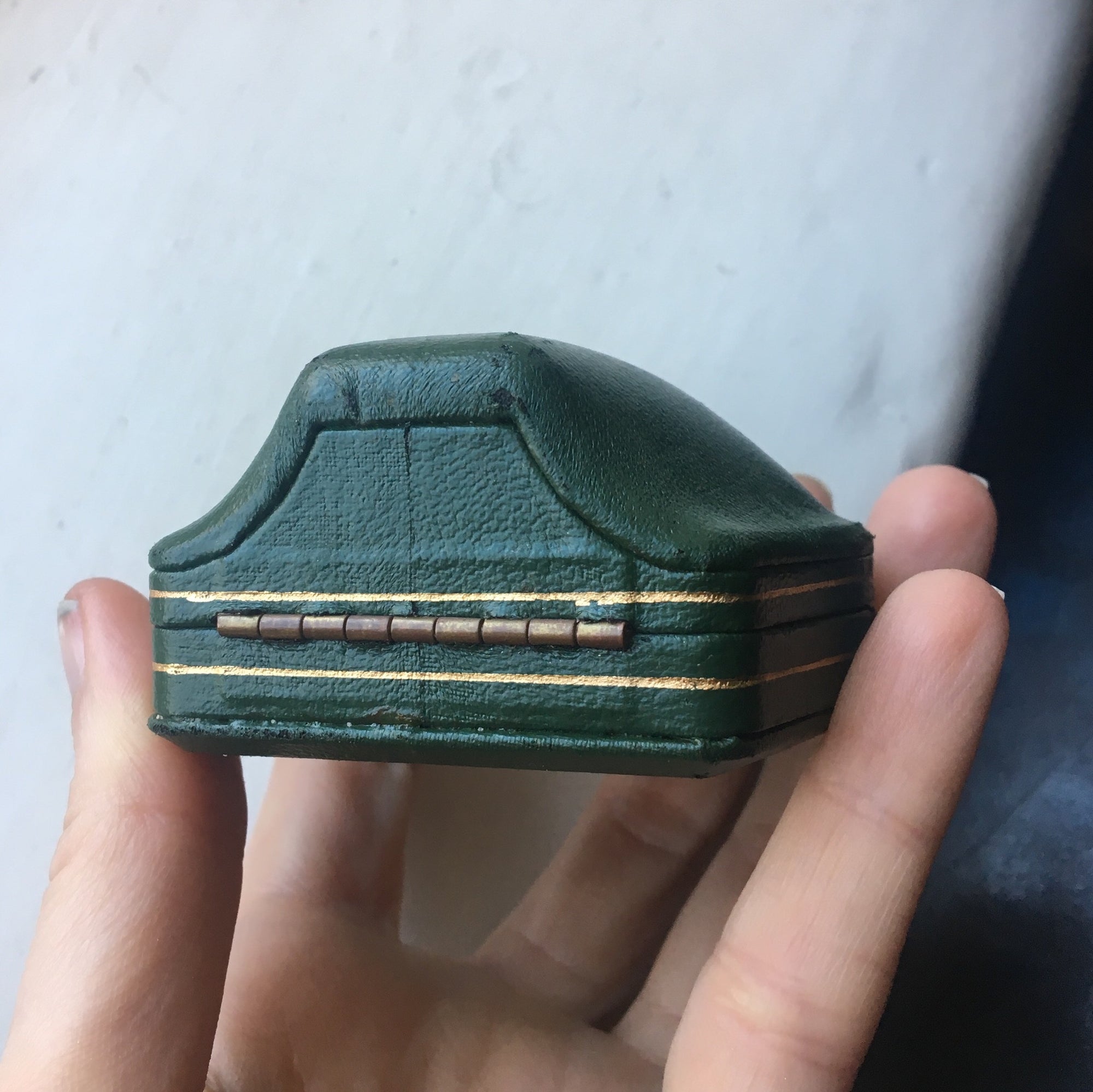 Domed leather boxes with gold trim detail