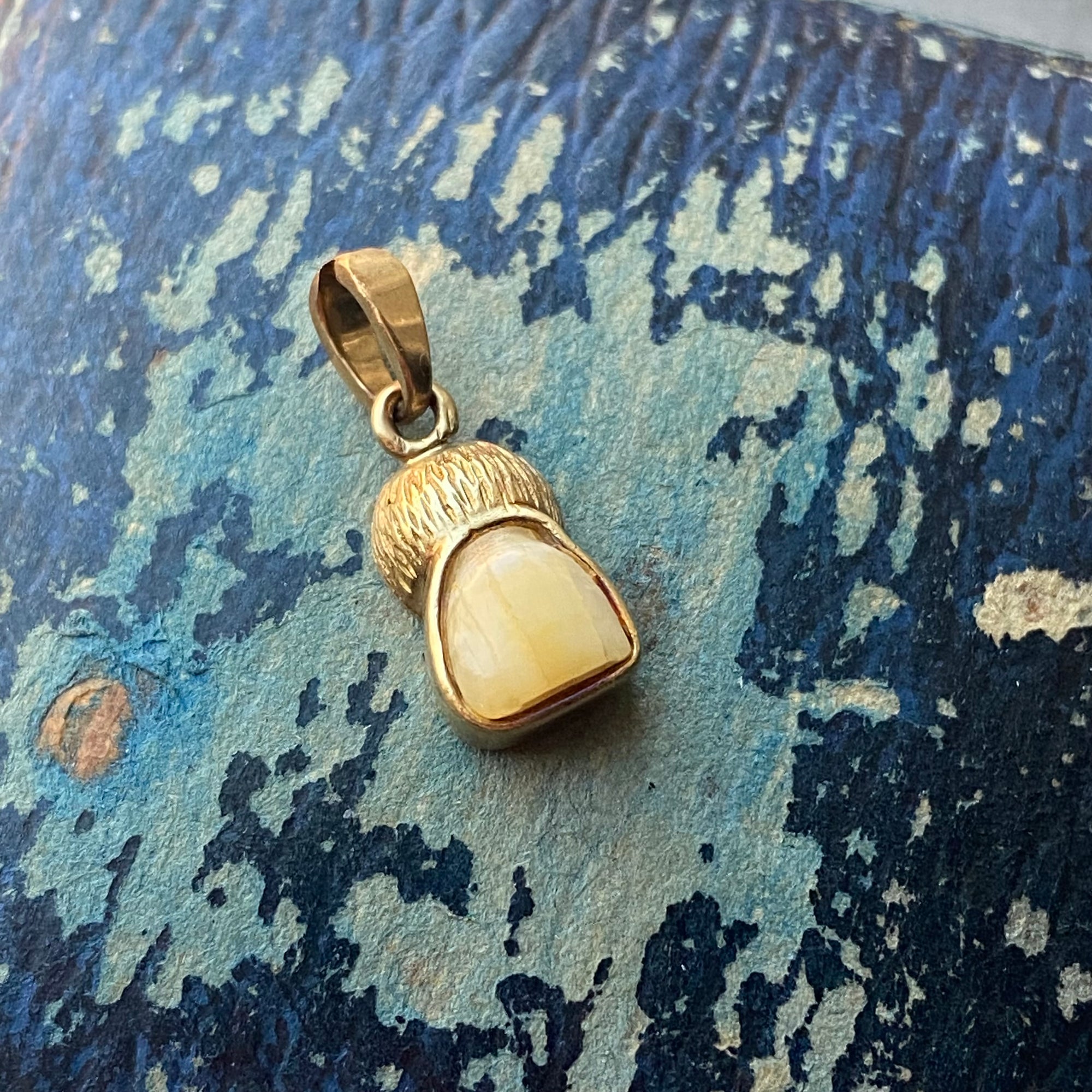 antique milk tooth charm