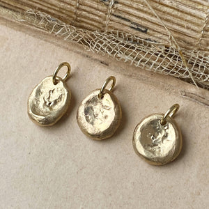 gold worry stone charm