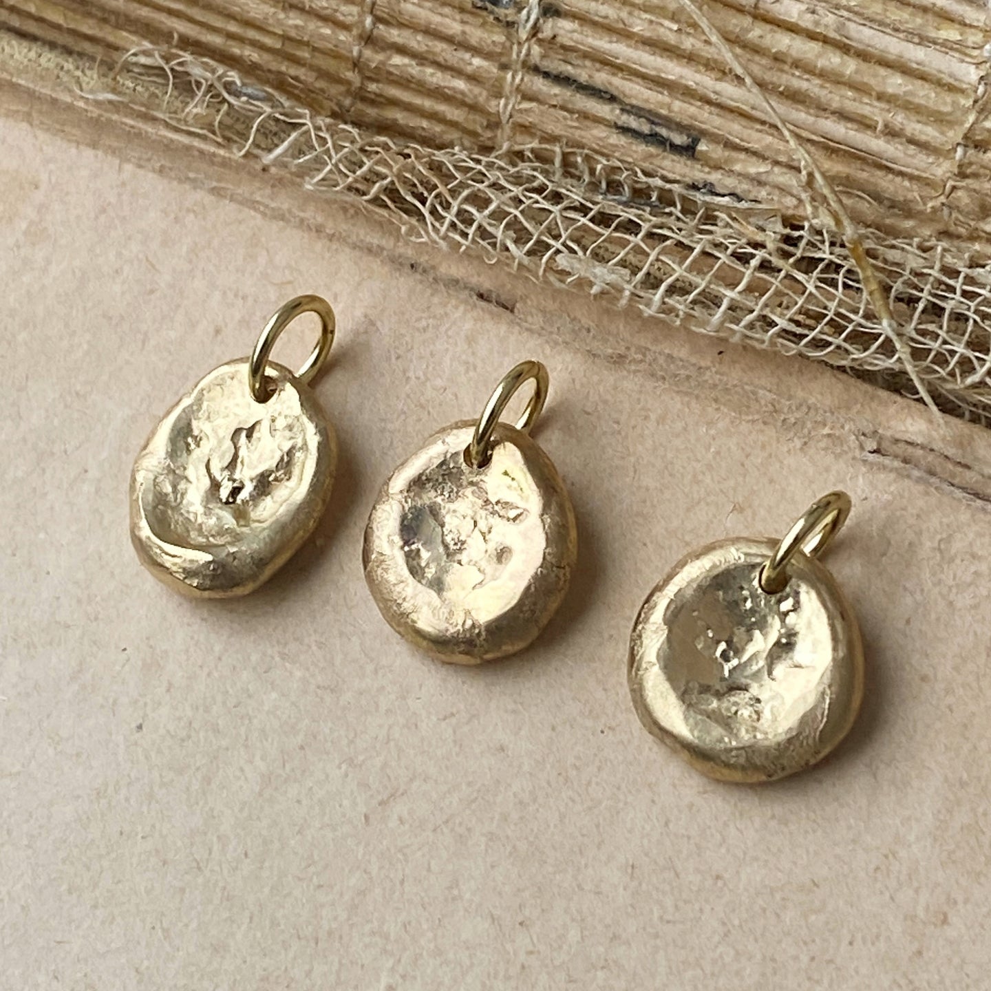 gold worry stone charm