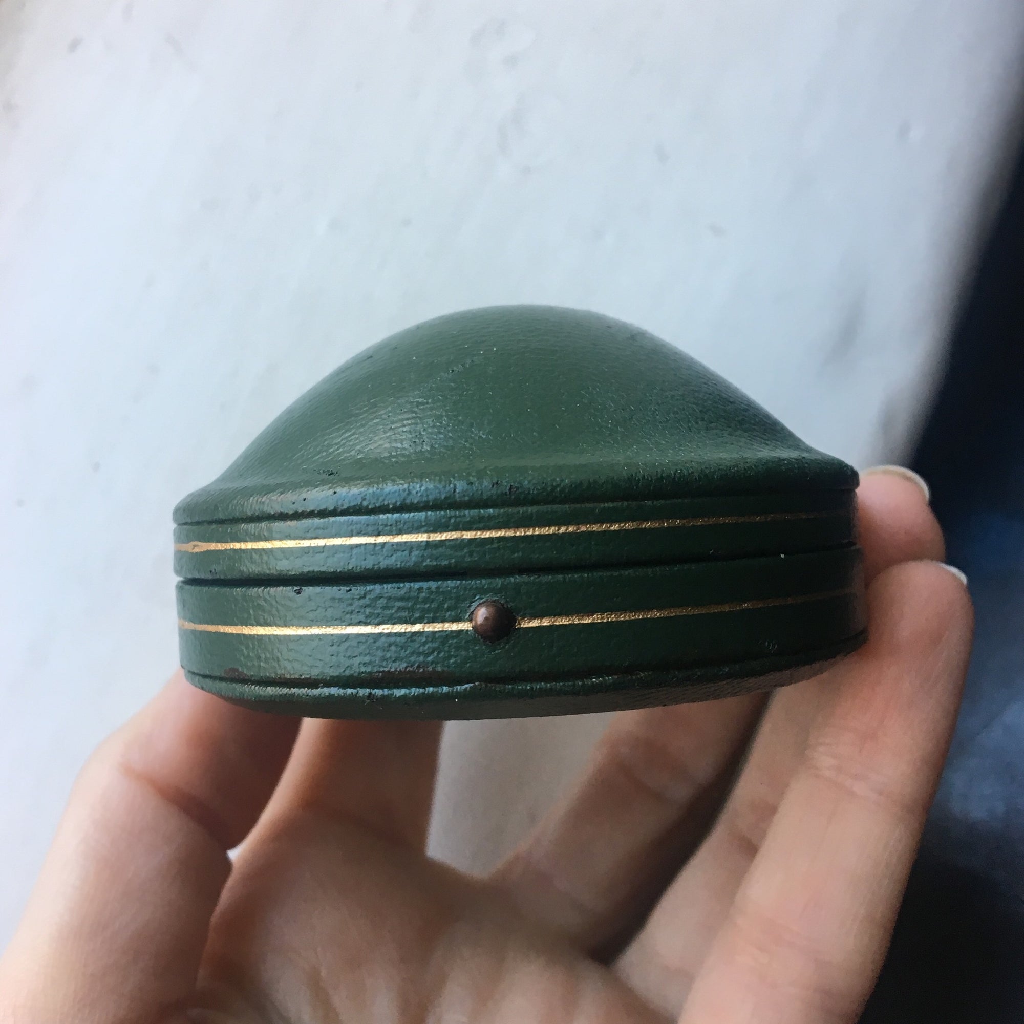 Domed leather boxes with gold trim detail