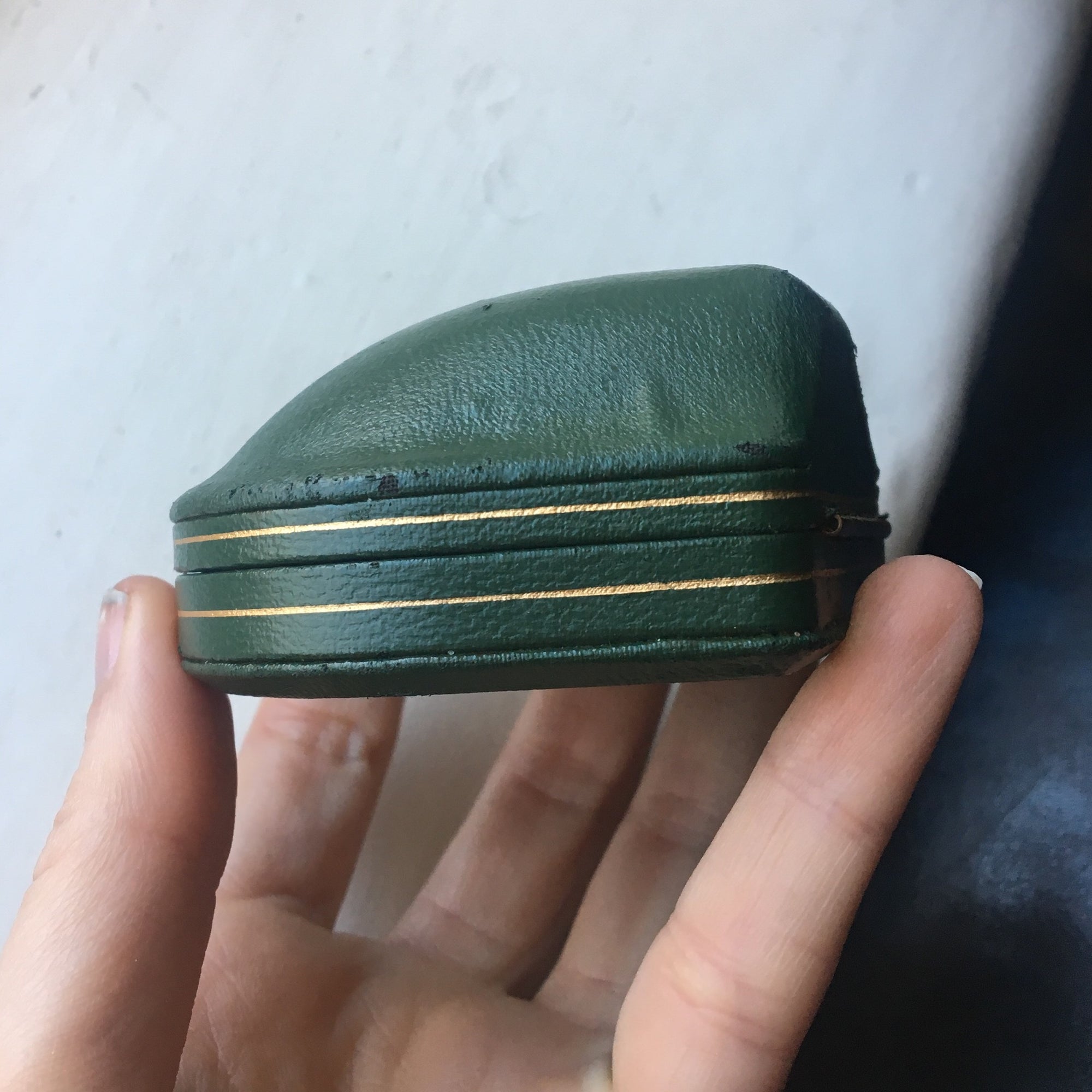 Domed leather boxes with gold trim detail